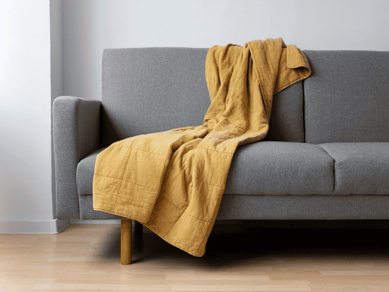 How To Put A Throw On A Couch - Decorating With The Classic Drape
