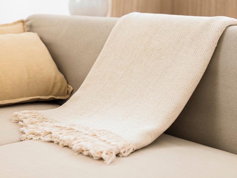 How To Put A Throw On A Couch - The Folded Arm Way For Small Blankets
