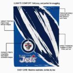 winnipeg jets brushstrokes blue white blanket best selling