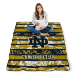 personalized notre dame fighting irish layered florals navy white quilt blanket best selling